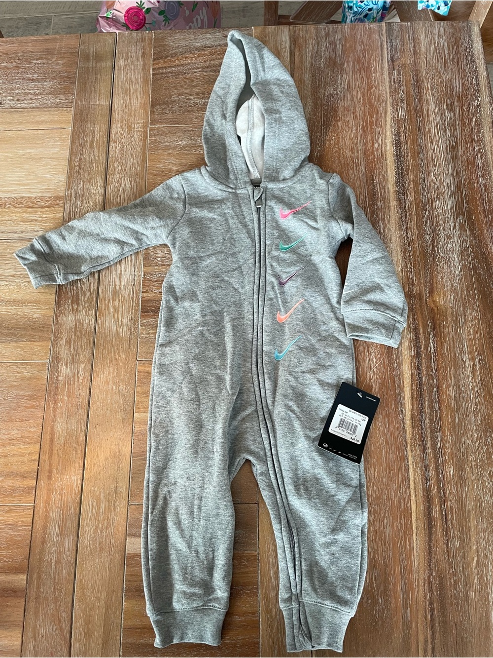 Nike Grey Hooded Kids One-Piece with Pastel Swoosh Accents
